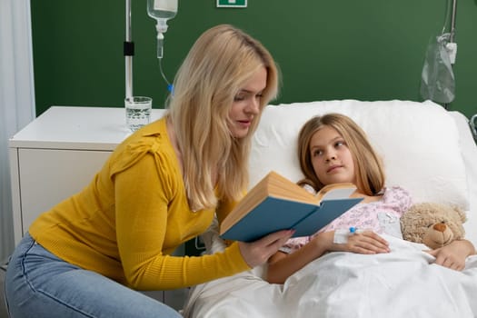 A nurturing mother is lovingly reading a story to her sick daughter, who is resting in a hospital room