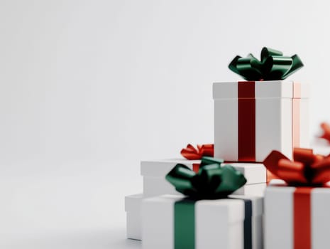 Elegant Christmas gift stack with white wrapping and festive ribbon decor.