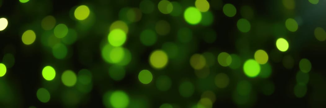 Vibrant green bokeh lights shimmer against a dark background, enhancing the festive ambiance. Perfect for nighttime events, they add a delightful glow to celebrations.