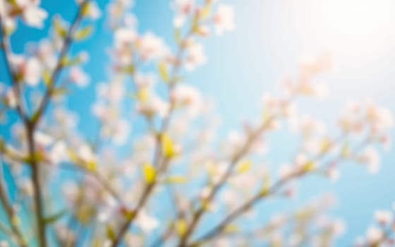 Delicate white blossoms fill the branches against a vibrant blue sky on a sunny spring day, creating a serene atmosphere and highlighting nature's splendor.