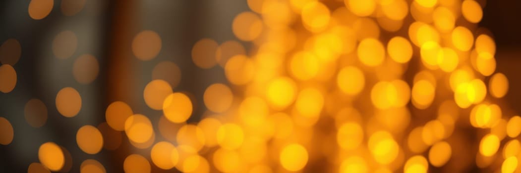 Twinkling golden lights fill the atmosphere of a snug gathering place, casting a warm glow that enhances the cheerful ambiance of the evening.