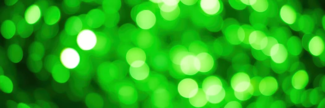 Soft green lights blur into swirling patterns, evoking a lively ambiance perfect for celebrations or artistic projects. The warm glow invites creativity and joy.