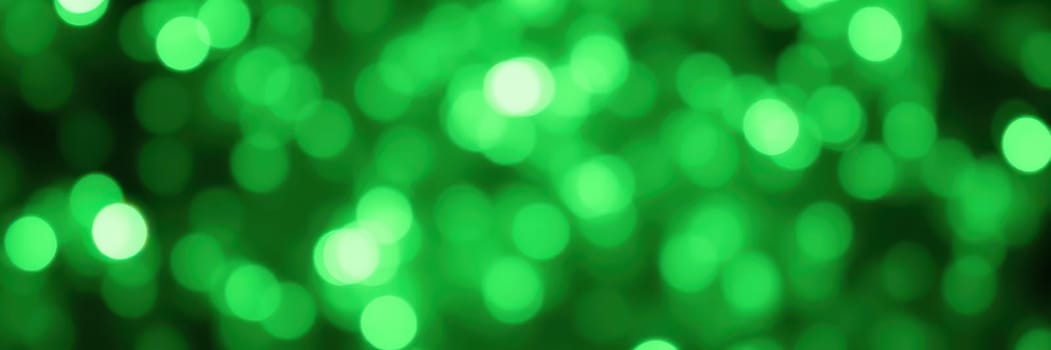 A dazzling display of bright green light creates a bokeh effect, offering a lively and festive atmosphere ideal for celebrations and gatherings. The shimmering light adds a magical touch.