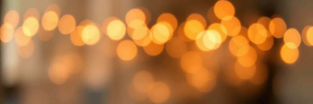 Warm, soft lights create a cozy atmosphere in an indoor setting, perfect for an evening gathering filled with friends and family enjoying each other's company.