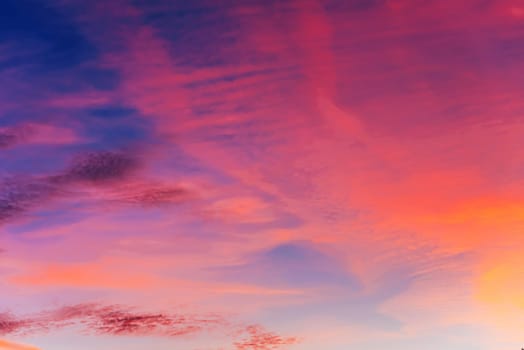 Pink clouds at sunset in a beautiful sky in the evening