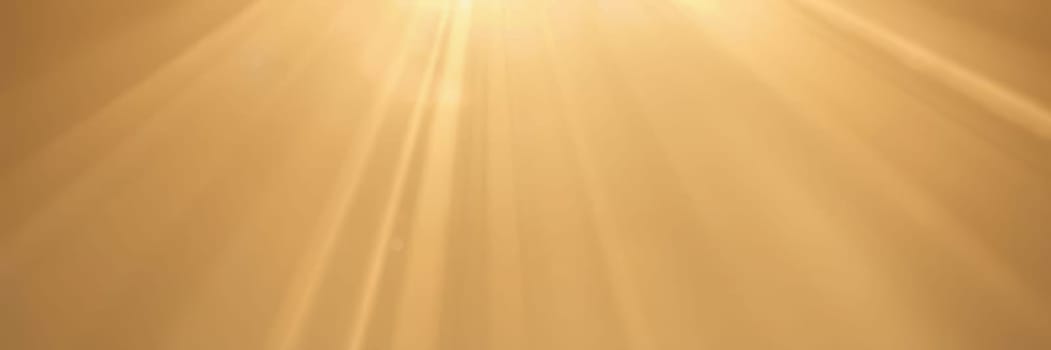 Soft golden rays illuminate the horizon as the sun sets. The warm light casts a serene ambiance over the landscape, enhancing nature's beauty during dusk.