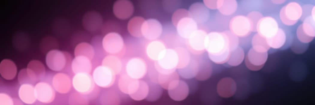 Bright, colorful bokeh lights illuminate a dark evening, enhancing the festive mood at an urban event with blurred backgrounds and sparkling effects.