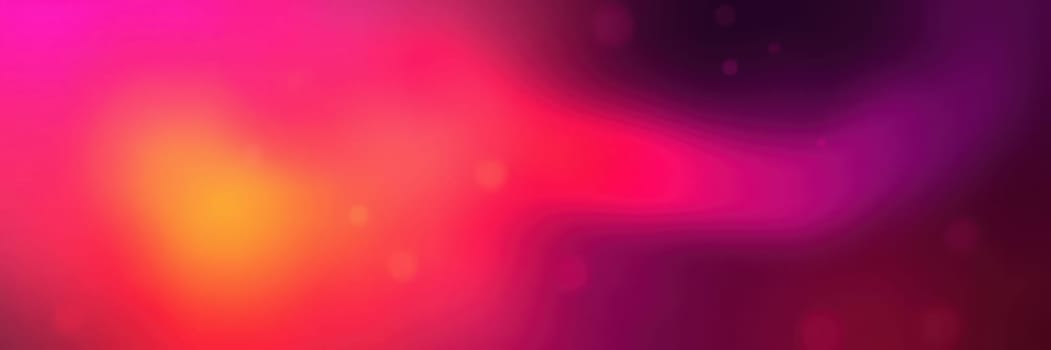 A rich blend of pink, purple, and orange colors merges to form an abstract background. The vibrant hues create a sense of movement and warmth, perfect for design purposes.