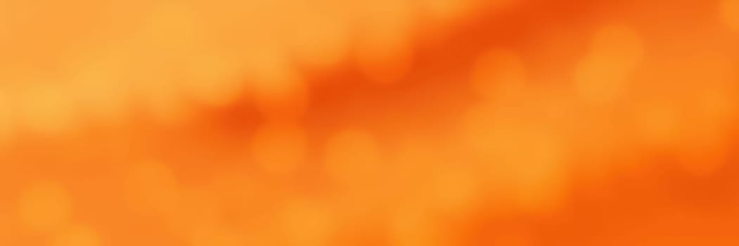 A stunning display of orange colors fills the sky at sunset, creating a warm and inviting atmosphere. The natural landscape below is illuminated softly, highlighting its beauty.