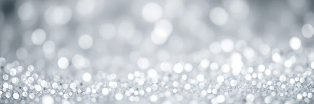 A beautiful display of shimmering silver bokeh lights creates an enchanting atmosphere, perfect for celebrations and special occasions, enhancing the joyful spirit of any event.