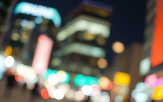 A lively urban area filled with colorful lights and blurred movement as people walk through the streets during a vibrant evening. The atmosphere is electric as the city comes alive.