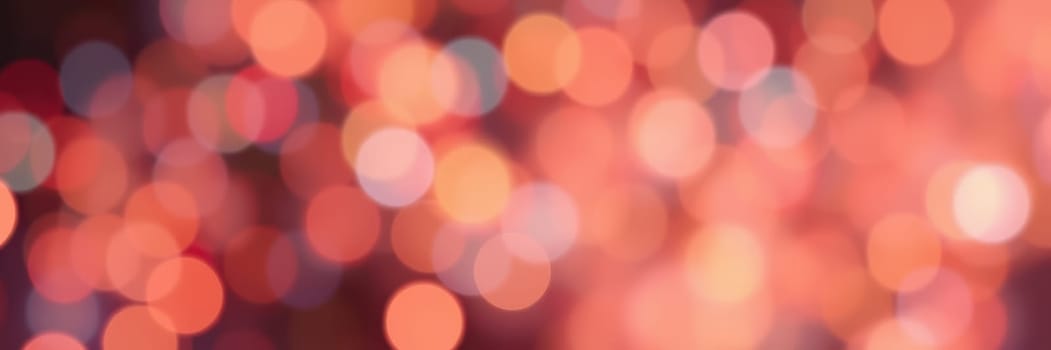 A captivating display of colorful bokeh lights illuminates the night sky, enhancing the festive mood during a celebration. The soft glow creates a magical ambiance.