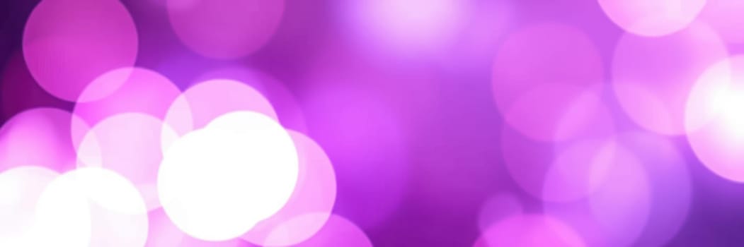 This vibrant bokeh background showcases a blend of purple and white circular lights, creating a dreamy and enchanting atmosphere suitable for design projects, events, or celebrations.