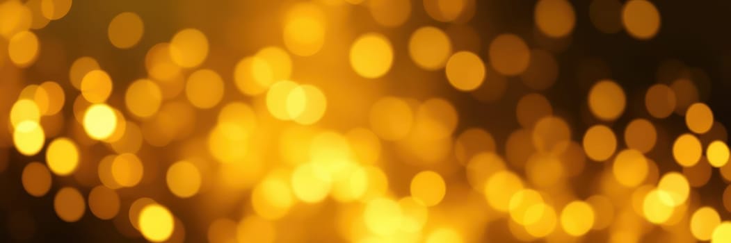 Soft golden bokeh lights fill the dark space, creating a warm and inviting atmosphere for a nighttime celebration or gathering. The lights twinkle gently.