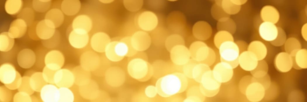 A multitude of soft, glowing golden lights creates a warm and festive ambiance, illuminating the surroundings during a joyful celebration at night.