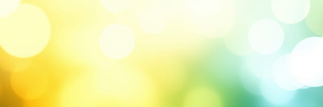 Soft bokeh effect creates an enchanting abstract background with vibrant yellow and blue hues, evoking a cheerful and lively atmosphere during daytime light.