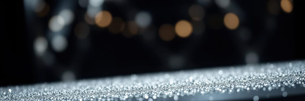 Delicate droplets of water glisten on a smooth surface, illuminated by soft, blurred lights in the background, creating an enchanting nighttime ambiance.