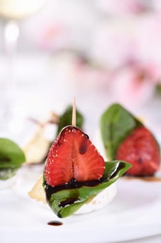  Strawberries, cheese, fresh basil and balsamic come together for a bite-sized appetizer