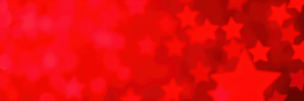 A vibrant red backdrop filled with star shapes creates a cheerful atmosphere, perfect for celebrations, parties, or festive gatherings under the night sky.