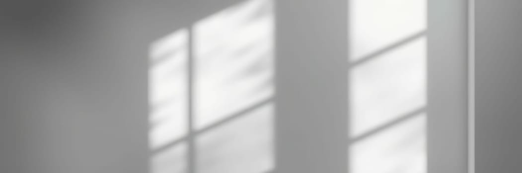 Soft rays of sunlight filter through a large window, casting gentle shadows on the floor. The ambiance creates a peaceful and calming atmosphere within this indoor space.