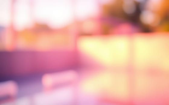 Soft colors blend in an abstract style, creating a dreamy atmosphere during sunset at an outdoor area, suggesting a peaceful and serene moment.