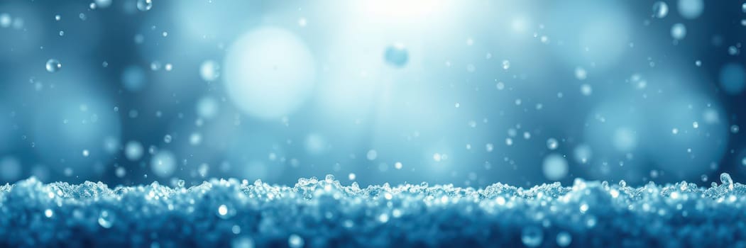 Gentle water droplets fall onto a smooth surface, creating ripples in the blue atmosphere of a calm rainfall during early morning hours, evoking tranquility and peace.