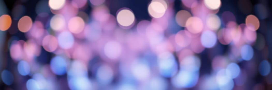 Soft bokeh lights in shades of blue, pink, and purple fill the atmosphere of a lively indoor event, creating a magical and enchanting environment for guests to enjoy.