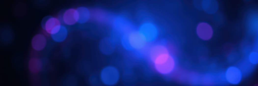 Vivid colors form an abstract swirl adorned with blue and purple bokeh lights, lending a magical and serene ambiance perfect for artistic inspiration or digital designs.