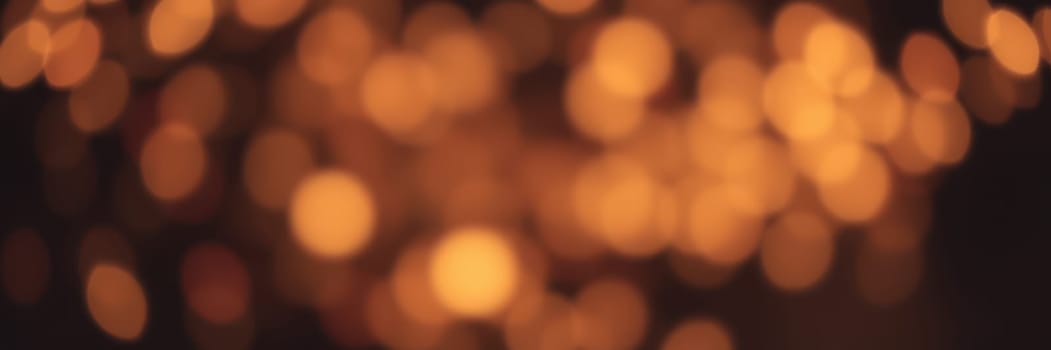 Soft golden bokeh lights fill the air, creating a warm and inviting atmosphere for social gatherings at night. The gentle glow enhances the ambiance, perfect for relaxation.