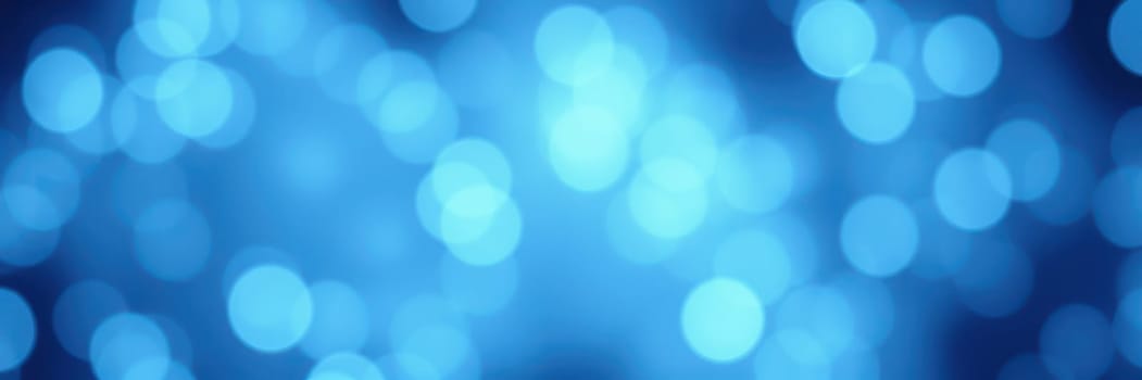 Soft blue bokeh lights illuminate a calm space, creating a tranquil ambiance. Gentle shapes blend together, adding depth to the soothing visual experience.