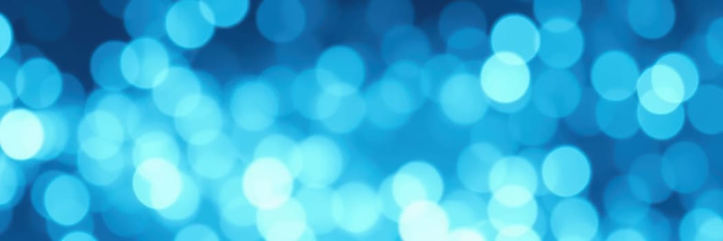 A beautiful display of soft blue bokeh lights fills the background, creating a serene and tranquil ambiance perfect for evening events and social gatherings, enhancing the experience.