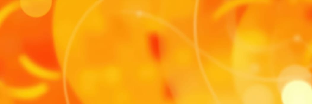 Swirls of orange hues filled with glowing circles and light reflections create a dynamic and warm abstract background, perfect for artistic projects and designs.