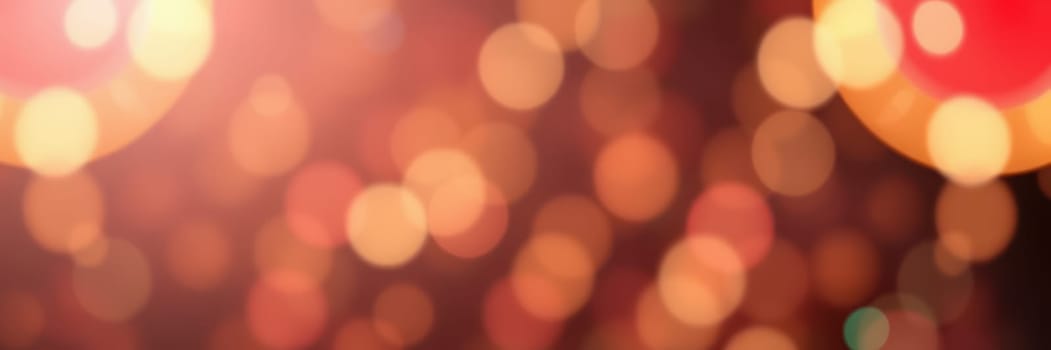 Soft, blurred bokeh lights illuminate the background, creating a warm and inviting ambiance perfect for a celebratory gathering or party.