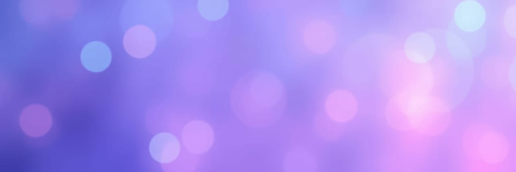 A beautiful array of soft pastel bokeh lights in purple and pink hues fills the background, adding a dreamy quality ideal for creative designs and artistic projects.