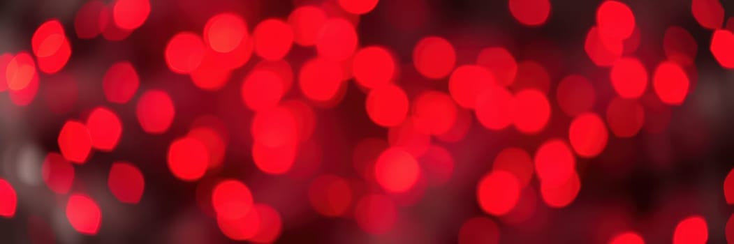 A collection of bright red bokeh lights fills the background, creating a lively and joyful ambiance that enhances the festive mood during nighttime festivities.
