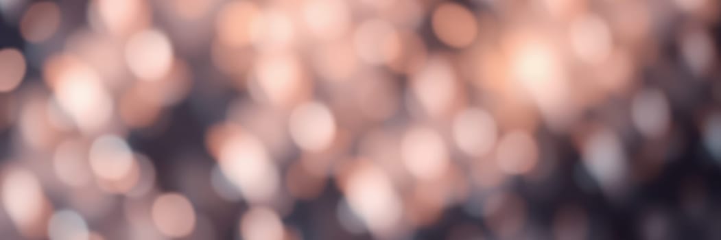 A gentle blur of warm lights forms a captivating bokeh effect, evoking a magical ambiance ideal for special events or creative projects, perfect for enhancing visual appeal.