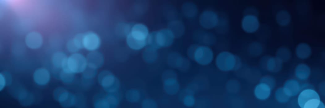 Gentle blue bokeh lights fill the background, creating a tranquil ambiance ideal for relaxation or evening gatherings. The soft glow enhances the mood and invites serenity.