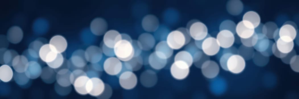 Soft blue background filled with shimmering bokeh lights creates a tranquil and dreamy ambiance, perfect for evoking a sense of calm and wonder. Ideal for various designs.