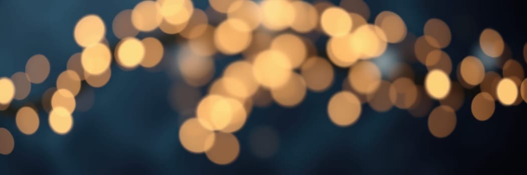 Glowing orbs of light illuminate the night sky, creating a warm atmosphere during an outdoor gathering. Friends enjoy each other's company surrounded by enchanting lights.