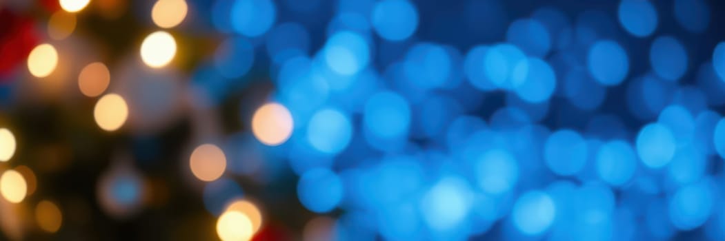 Soft blue and warm gold lights twinkle in a blurred background, creating a cozy and enchanting holiday ambiance for celebrations and gatherings.