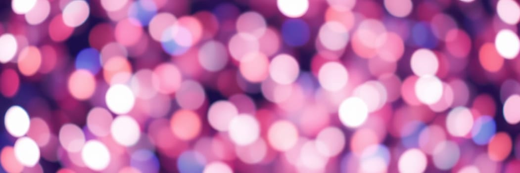 A vibrant arrangement of pink and purple lights creates a dreamy bokeh effect that provides a soft and colorful backdrop. This atmosphere is perfect for various design projects.