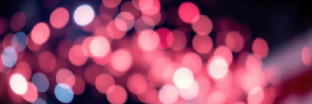 Bright, colorful bokeh lights fill the background, creating a lively and festive atmosphere in an urban area at night, perfect for celebrations and gatherings.