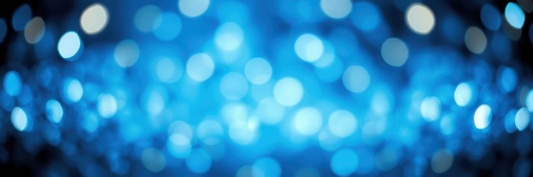 Soft blue bokeh lights shimmer in the background, offering a beautiful and festive atmosphere suitable for parties or special occasions. The lights create a magical and inviting environment.