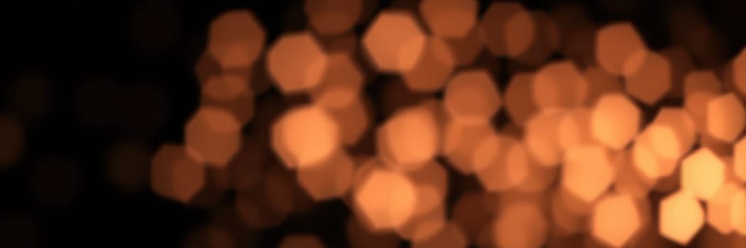 The warm amber lights softly illuminate a cozy gathering space filled with people enjoying their drinks and conversation during a lively evening.