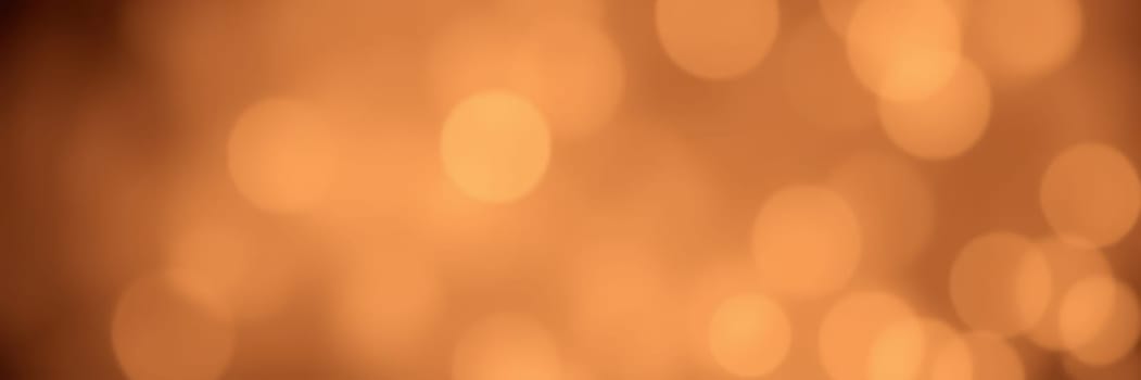 Soft golden bokeh lights illuminate the space, creating a warm and inviting ambiance during a winter celebration. The scene conveys a sense of joy and festivity.
