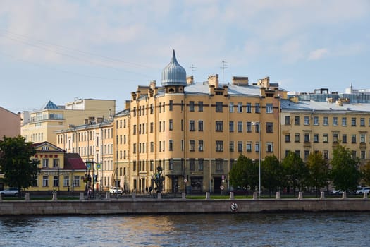A picturesque and charming setting that features stunning historical buildings beautifully lining a riverside