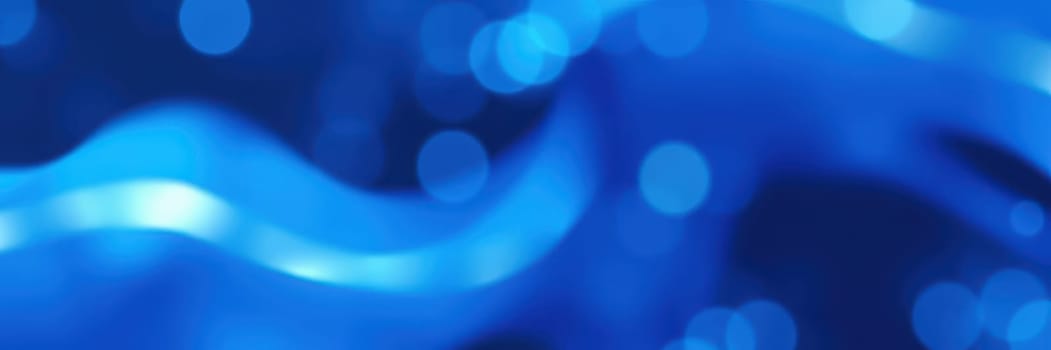 Gentle waves flow in shades of blue, creating a vibrant and dynamic visual effect. The interplay of light enhances the sense of movement and depth, evoking a tranquil atmosphere.