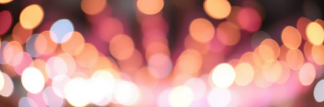 A dazzling display of colorful bokeh lights fills the background, adding a magical touch to the nighttime festivities and creating a cheerful ambiance.