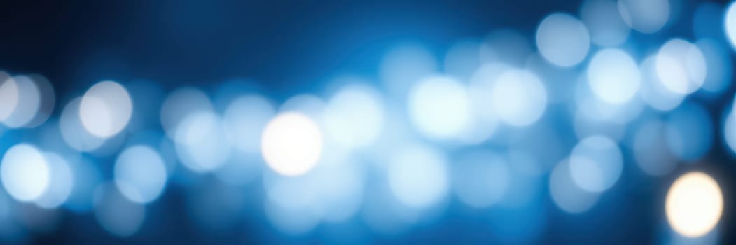 Soft blue bokeh lights create a calming atmosphere ideal for celebrations or quiet evenings. The gentle glow enhances spaces, adding charm and depth to experiences.