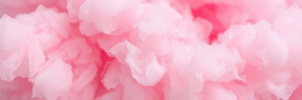 Fluffy pink cotton candy swirls create a delightful treat, bringing joy to visitors at a summer fair, evoking nostalgia and celebration under the sun.